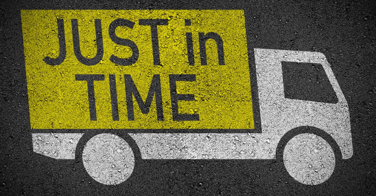 An image of a truck is spray painted on a patch of asphalt. The truck is white while the trailer is painted yellow.
